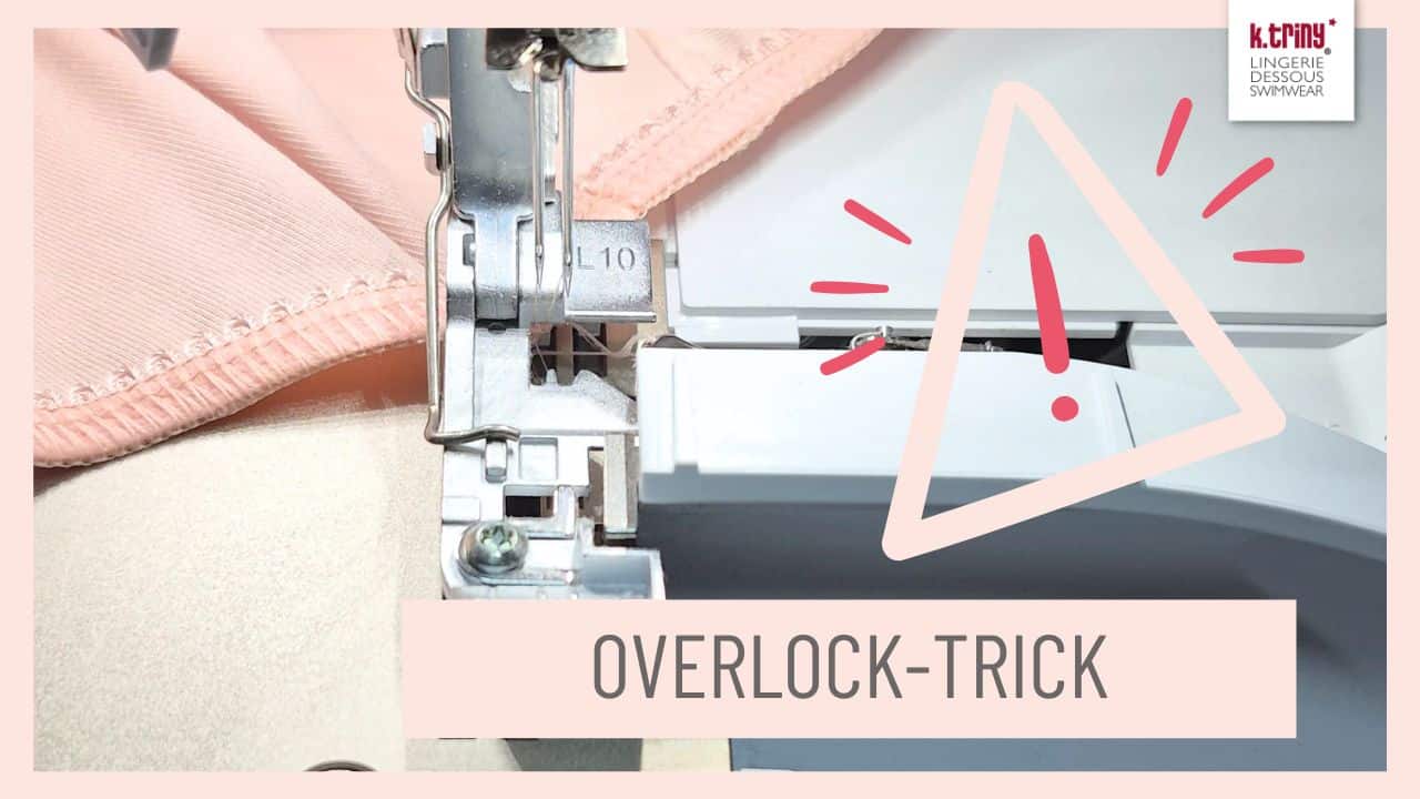 Overlock-Trick beim Nähen – Nahaufnahme einer Overlockmaschine mit Stoff unter dem Nähfuß